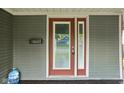 Front door with glass window and mail slot, plus a peek at the inviting porch at 6159 Broadway St, Indianapolis, IN 46220