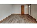 Bright living room featuring wood-look flooring and neutral walls, ready for your personal touch at 6985 E County 100 S Rd, Avon, IN 46123