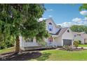 Beautiful two-story home with a covered front porch and mature trees at 7388 Wythe Dr, Noblesville, IN 46062