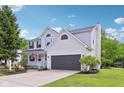 Charming two-story home featuring an attached garage and beautifully landscaped front yard at 7388 Wythe Dr, Noblesville, IN 46062