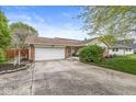 Traditional brick ranch featuring an attached two-car garage and a well-maintained front yard at 745 N Madison St, Fortville, IN 46040