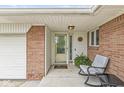 Inviting covered entry with a cozy seating area, perfect for enjoying quiet moments outside at 745 N Madison St, Fortville, IN 46040
