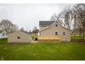 This house features a large backyard and deck, perfect for outdoor gatherings at 933 N 19Th N St, Elwood, IN 46036