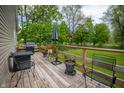 Outdoor patio with chairs and grill perfect for relaxing and entertaining guests at 933 N 19Th N St, Elwood, IN 46036
