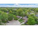 An aerial view of the home's neighborhood featuring mature trees and landscaping at 9526 Burrwood Ct, Indianapolis, IN 46235