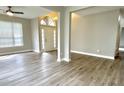 Bright living room featuring new floors, neutral paint, and a view into the entry at 10305 Lakeland Dr, Fishers, IN 46037