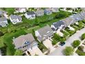 A neighborhood displaying various home styles and well-manicured lawns at 12722 Moonseed Dr, Carmel, IN 46032