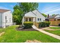 Charming home featuring a welcoming porch and manicured landscaping at 1337 N Concord St, Indianapolis, IN 46222
