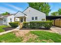 Charming home featuring a welcoming porch, manicured landscaping, and a convenient carport at 1337 N Concord St, Indianapolis, IN 46222