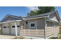 Detached garage with white door and siding matching the main house at 1527 N C N St, Elwood, IN 46036