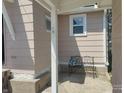 Cozy patio area with a wrought iron bench, perfect for relaxing outdoors at 1527 N C N St, Elwood, IN 46036