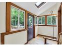 Bright, sunlit entryway featuring wood trim, ample windows, and a skylight at 1530 E 75Th St, Indianapolis, IN 46240