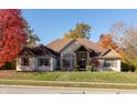 Beautiful single Gathering home featuring a stone and brick facade and manicured lawn at 1832 Live Oak Ct, Avon, IN 46123
