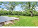 Lush backyard with a picnic table and ample space for outdoor activities and relaxation at 1944 Galeston Ct, Indianapolis, IN 46229