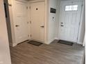 Inviting entryway featuring three doors and modern flooring at 230 Kiawah Dr, Whiteland, IN 46184