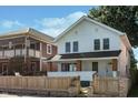 Charming two-story home with a well-maintained front yard and a classic white exterior at 2442 Guilford Ave, Indianapolis, IN 46205