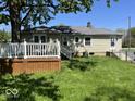 Back exterior of home showing large backyard with deck, perfect for outdoor entertaining at 3209 Mounds Rd, Anderson, IN 46016
