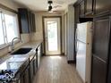 Well-lit kitchen featuring modern countertops and stainless steel appliances at 3209 Mounds Rd, Anderson, IN 46016