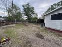 Backyard featuring grassy areas, utility access, and a shed; great for outdoor activities at 350 Johnson Ave, Franklin, IN 46131