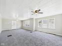 Bright living room featuring carpet, neutral walls, and large windows at 3631 Columbus Ave, Anderson, IN 46013