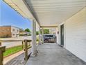 Spacious covered front porch with white columns and a street view at 3631 Columbus Ave, Anderson, IN 46013