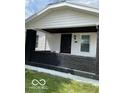 Charming home exterior featuring a quaint front porch with black brick and a freshly painted entrance at 3720 W 16Th St, Indianapolis, IN 46222