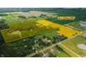 Aerial view of 55+/- total acres, featuring a private pond, lush farmland, and a peaceful wooded area at 4363 E State Road 252, Franklin, IN 46131