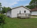 This home features neutral siding and a charming porch area, perfect for relaxing outdoors at 470 N Pine St, Morgantown, IN 46160