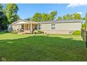 Charming single-story home featuring a cozy covered porch and well-maintained front yard at 48 W Adams Brick Ave, Martinsville, IN 46151
