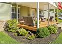 Welcoming front porch with seating, plants, and inviting decor at 48 W Adams Brick Ave, Martinsville, IN 46151