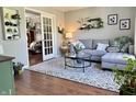 Cozy living room featuring a comfortable sectional sofa, a glass coffee table, and an inviting decor at 523 Torrey Ct, Avon, IN 46123