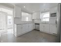 Modern kitchen with stainless steel appliances, ample storage, and stylish backsplash at 701 Lincoln St, Indianapolis, IN 46203