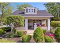 Charming home with landscaped front yard and inviting porch at 744 Gilbert Ave, Indianapolis, IN 46227