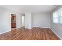 Open living space with hardwood floors and neutral paint, leading to the kitchen at 8144 E 50Th St, Indianapolis, IN 46226