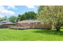 Expansive backyard featuring a wooden deck perfect for outdoor entertaining and relaxation at 8630 E Mcgregor Rd, Indianapolis, IN 46259