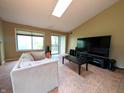 Spacious living room with tile floors and a large window offering natural light at 93 Lookout Ridge Dr # 24U, Columbus, IN 47201