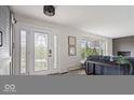 Welcoming foyer featuring a decorative glass door and access to the living room at 1242 W Huntsville Rd, Pendleton, IN 46064