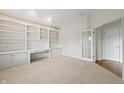 Well-lit office featuring custom built-ins and neutral carpet at 12739 Kiawah Dr, Carmel, IN 46033