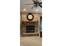 Close-up of brick fireplace with decorative mantle, perfect for cozy evenings at 12974 Shandon Ln, Fishers, IN 46038