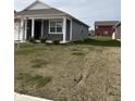 Side view of a well-maintained single-story home with a green lawn at 1380 Fairmount Dr, Greenfield, IN 46140