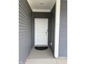 Inviting front entrance with a white door and matching trim at 1380 Fairmount Dr, Greenfield, IN 46140