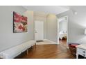 Inviting foyer with wood floors, neutral paint and view to bedroom at 14634 Village Park East Dr, Carmel, IN 46033