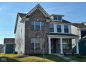 Two-story home featuring a blend of brick and siding, complemented by professionally landscaped surroundings at 1679 W 171St St, Westfield, IN 46074