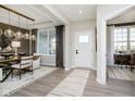 Inviting entryway with a white front door, pendant lighting, and stylish decor at 18943 Seaforth Way, Westfield, IN 46074