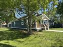 Well-kept home with a neat lawn and a welcoming front porch at 2009 Draper St, Indianapolis, IN 46203