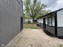 View of backyard, showing the home, shed, and AC unit at 2435 Asbury St, Indianapolis, IN 46203
