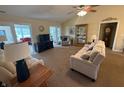 Bright living room with vaulted ceilings, plush carpeting, and French doors leading to the outdoors at 2635 Red Admiral Ln, Lebanon, IN 46052
