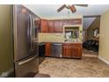 Kitchen with stainless steel appliances, cherry cabinets, and tile flooring at 270 Rapid Rill Ln, Brownsburg, IN 46112