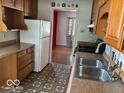 Functional kitchen with stainless steel sink and appliances; ready for everyday cooking at 3528 Orchard Ave, Indianapolis, IN 46218