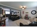 Open-concept living room offers bright white ceramic tile and lots of natural light at 4274 Blackwood Ct, Greenwood, IN 46143